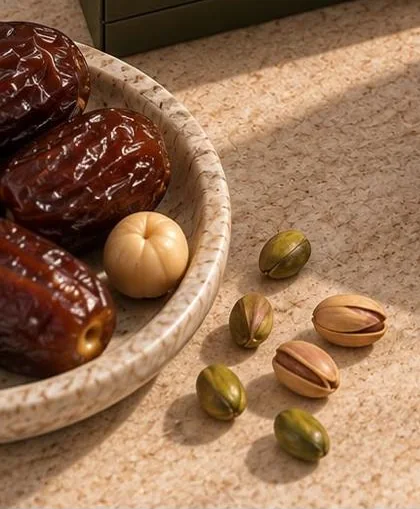 Medjool dates and whole nuts in a stone bowl
